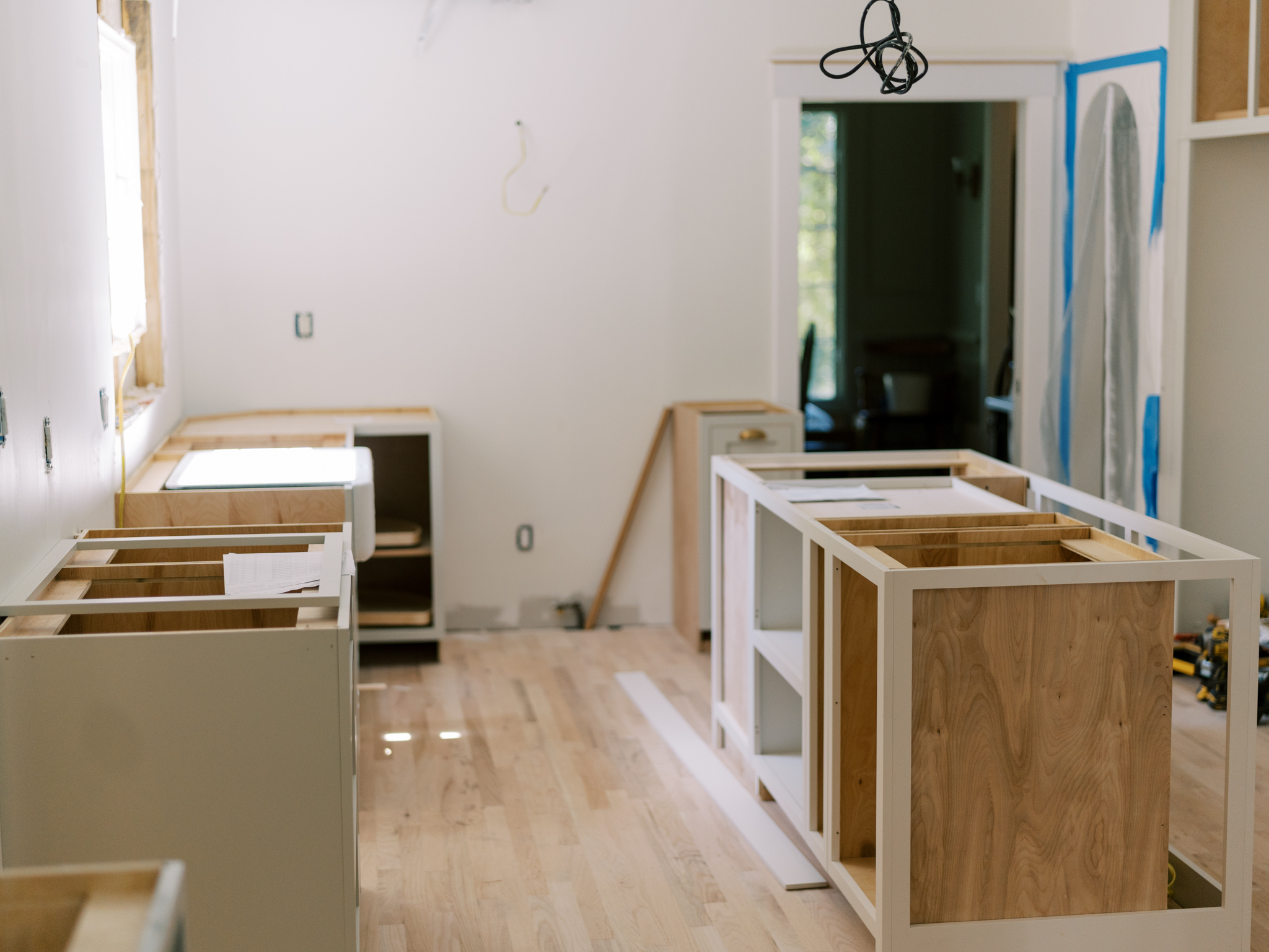 Kitchen under construction with cabinet joint cabinets.