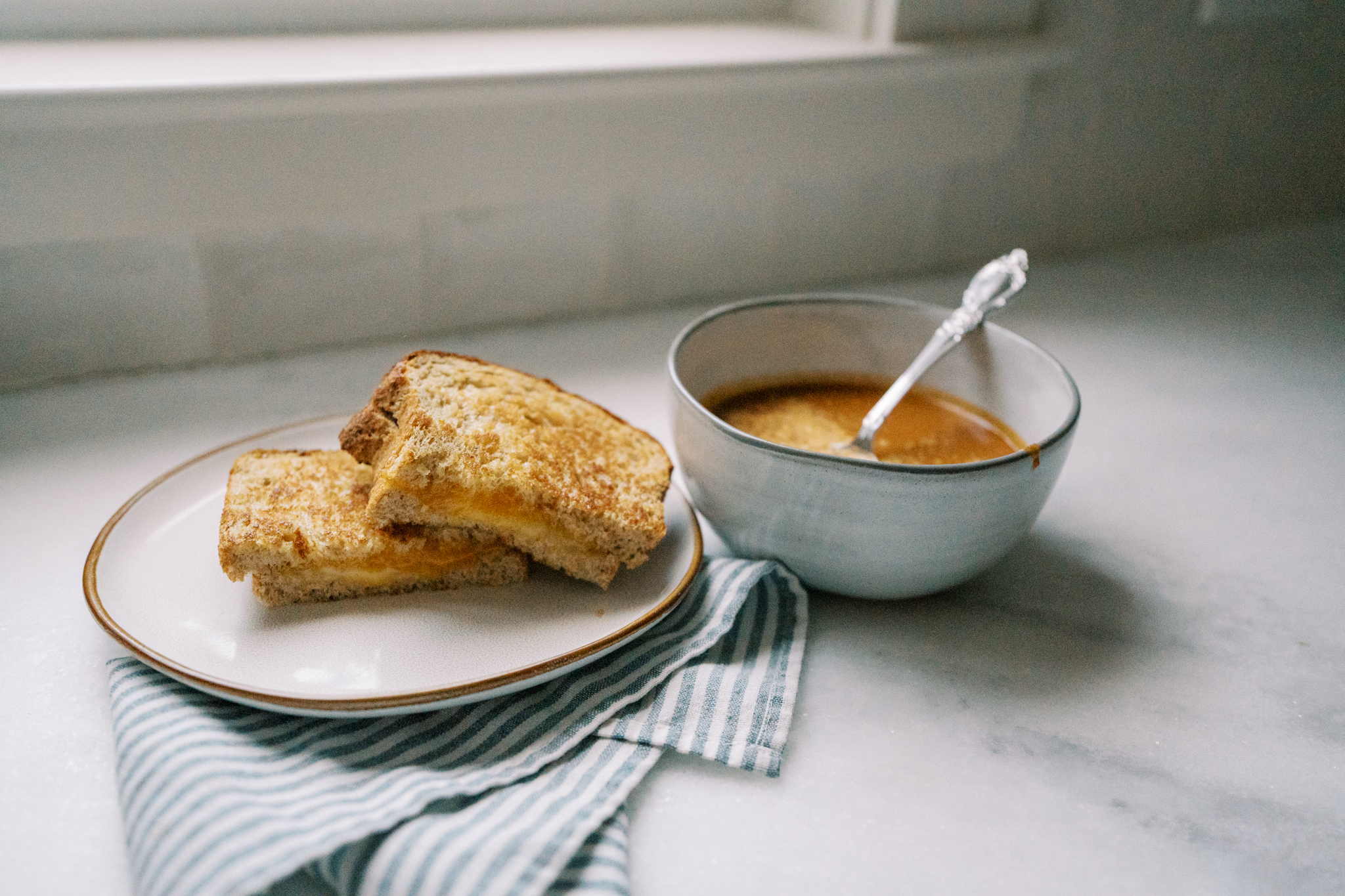 Tomato soup and grilled cheese for budget friendly family dinner