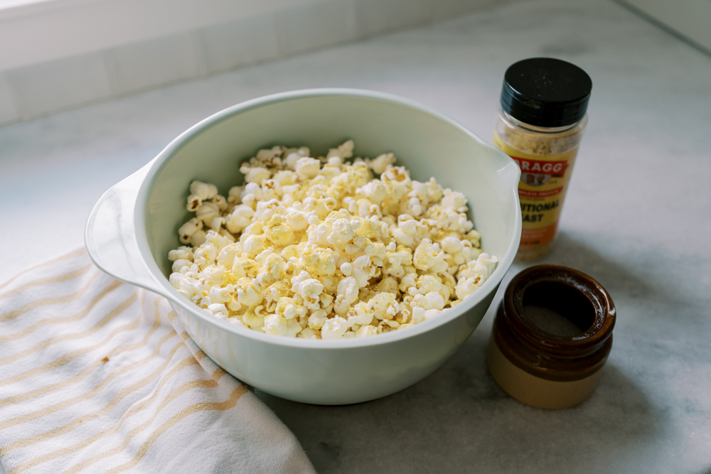 homemade stove top popcorn with nutritional yeast in a bowl on the counter