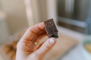 hand holding up fudge snack bar