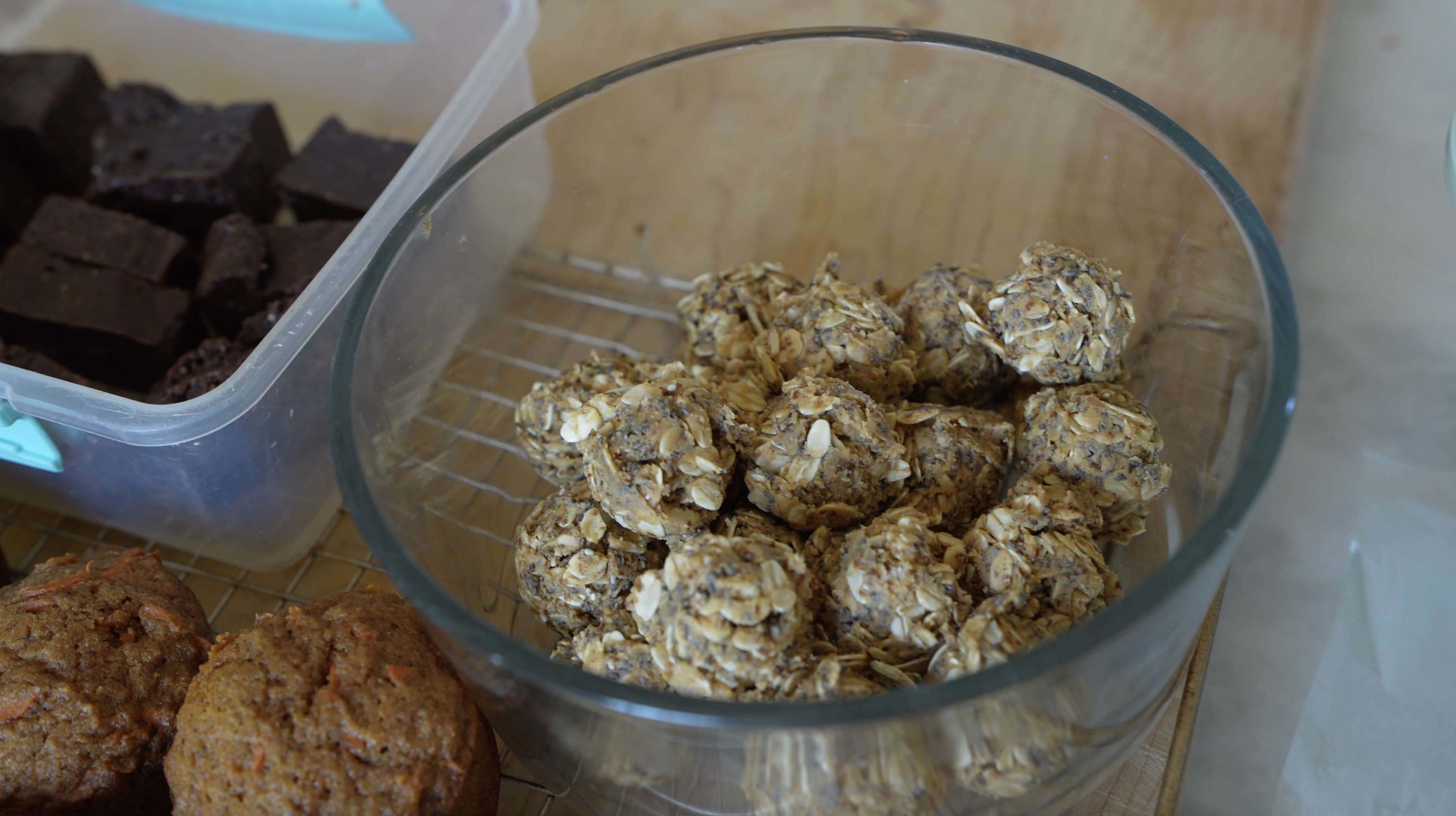 peanut butter energy bites on the counter with other homemade snacks