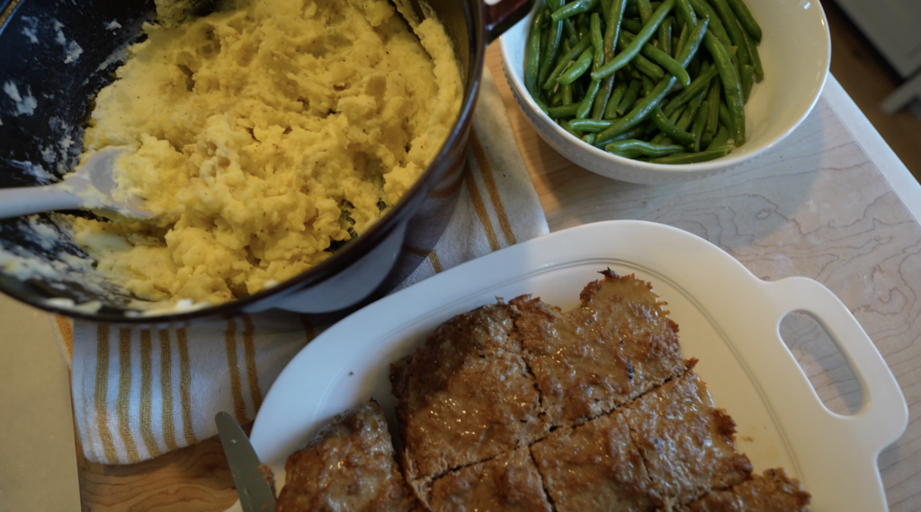 healthy meatloaf on a plate and mashed potatoes and green beans