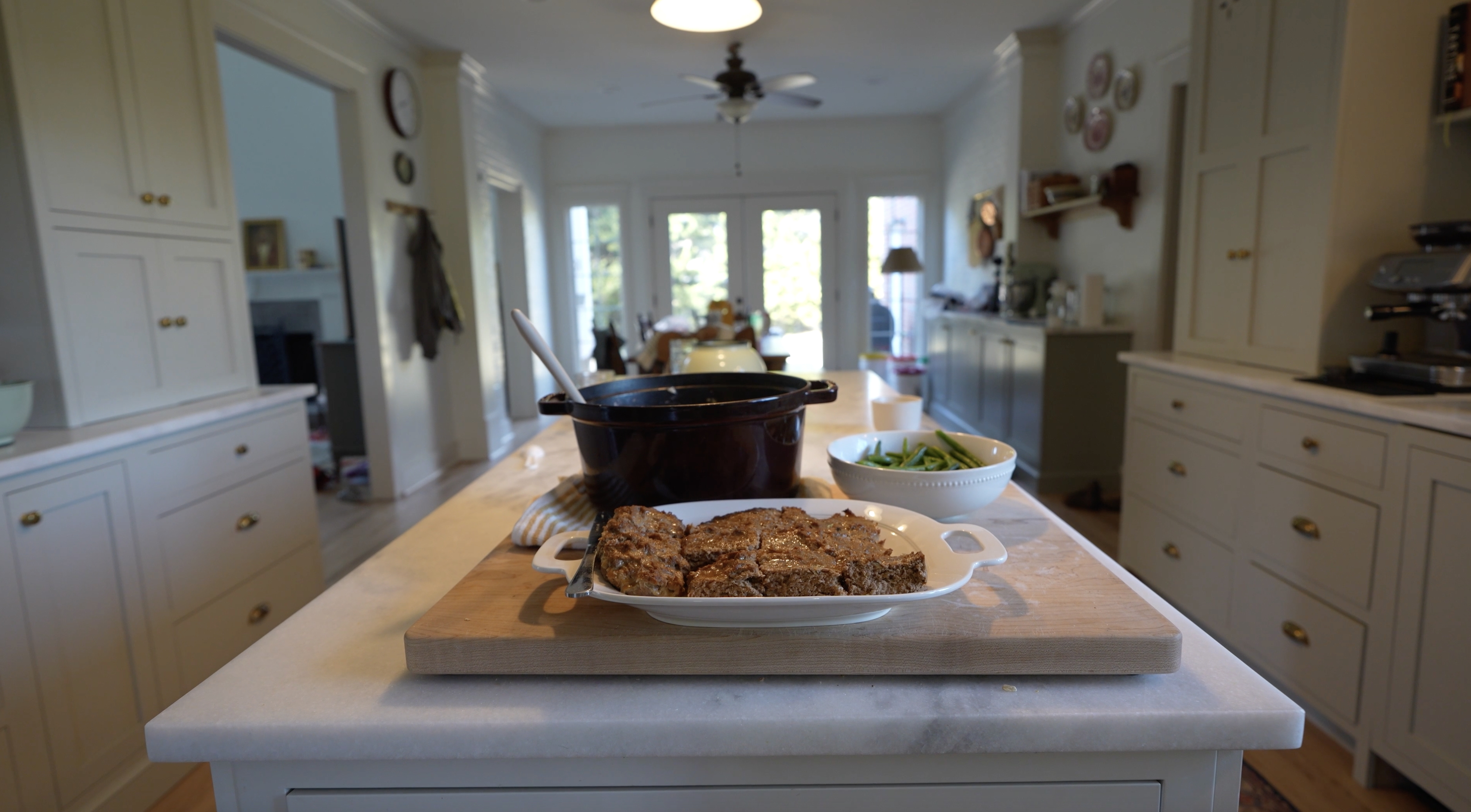 healthy meatloaf on a serving plate on a counter in a beautiful kitchen