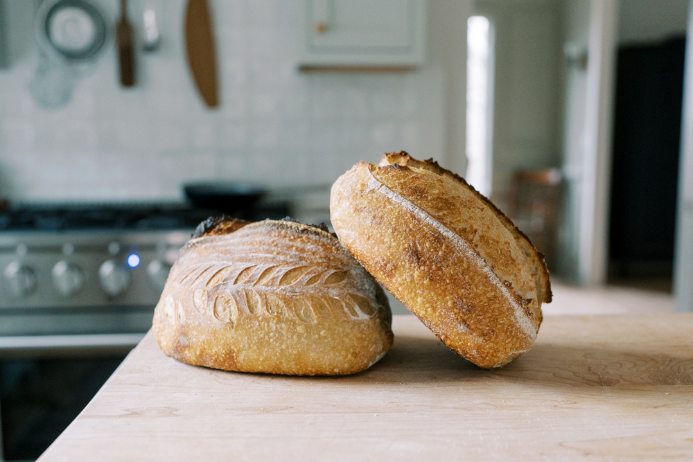 artisan sourdough bread sitting on a counter