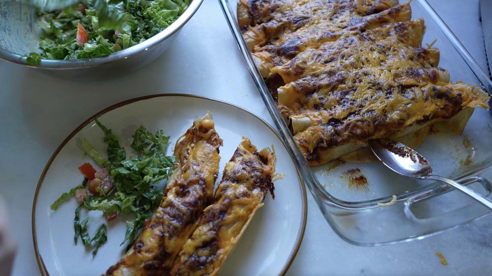 a beautiful family dinner of chicken enchiladas