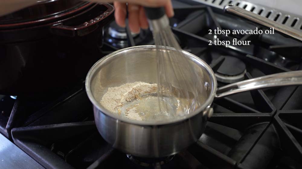 woman making a roux for enchilada sauce