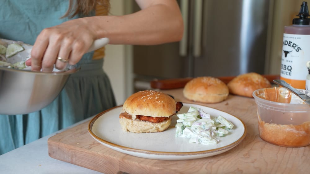 easy summer meal of bbq chicken sandwiches and cucumber salad