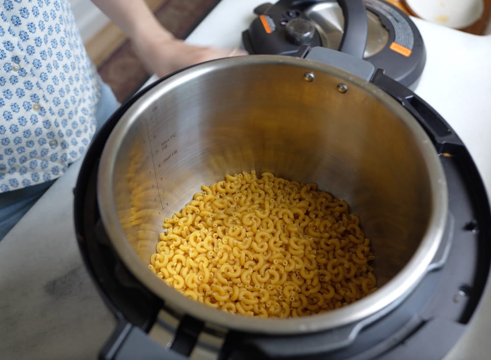 Instant pot filled with dry pasta