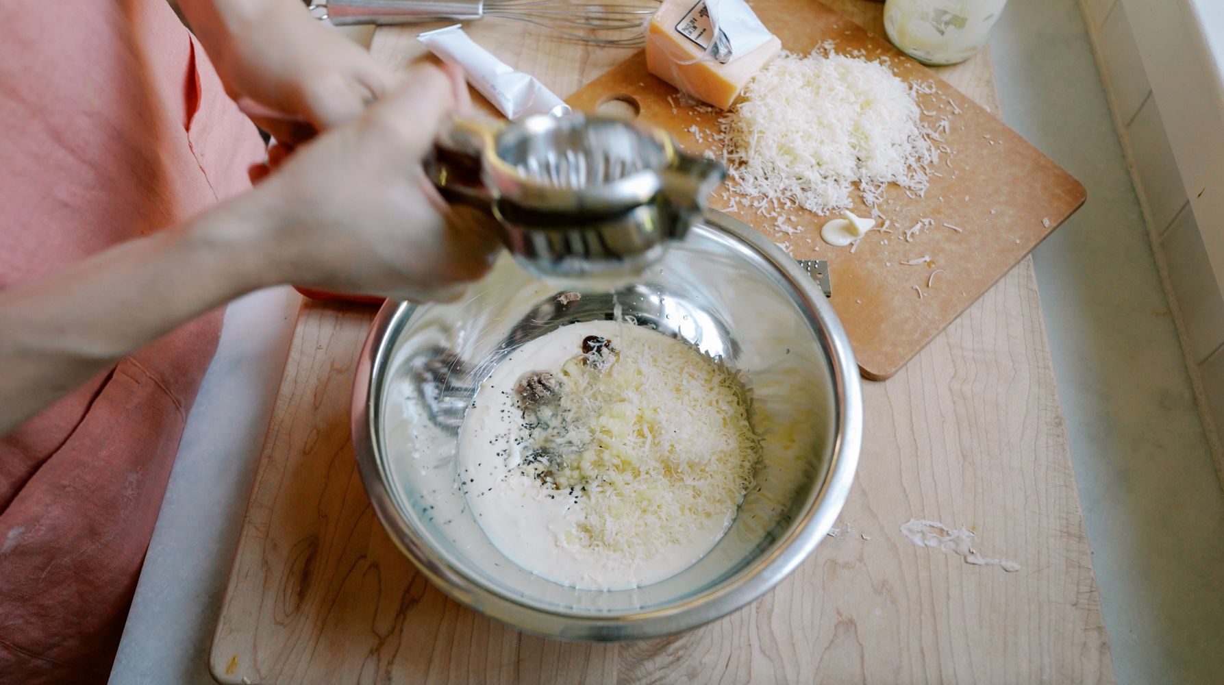 ingredients for caesar salad dressing in a bowl