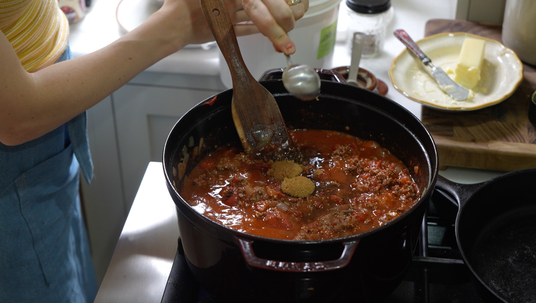 adding flavor boosters to simmering chili