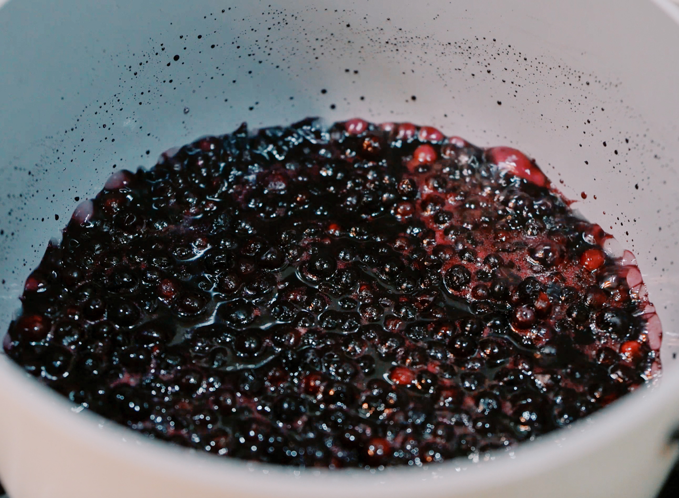 blueberries simmering in a sauce pan