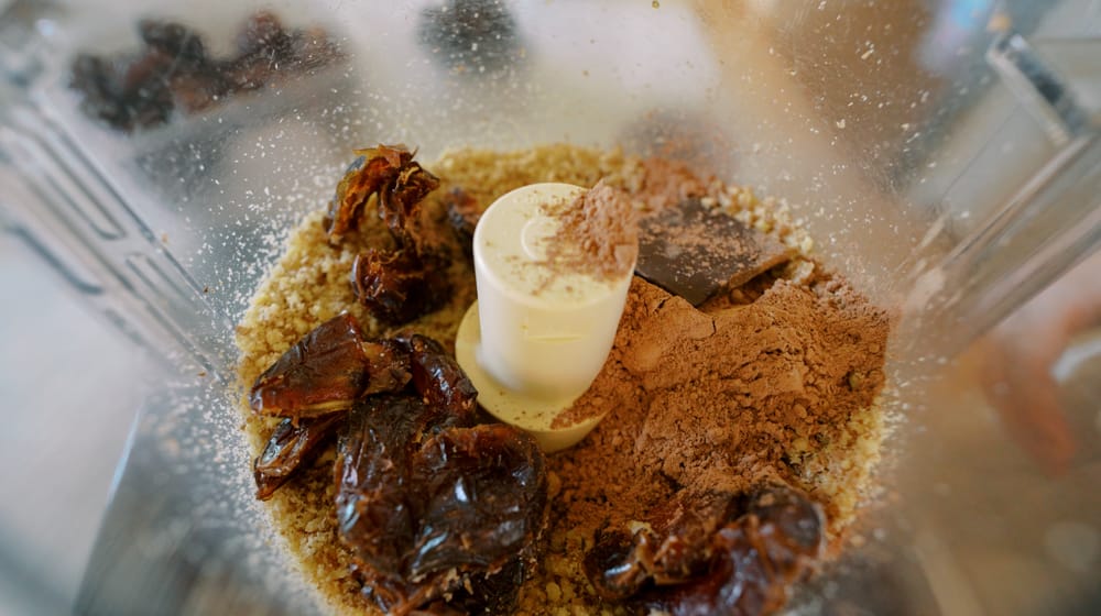 homemade protein bar ingredients in a food processor 