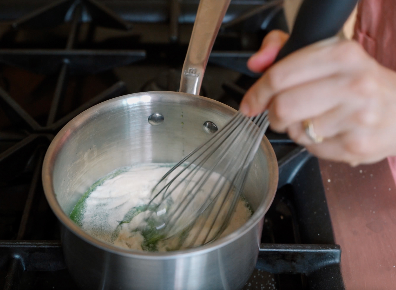 whisking gelatin into a fruit snack mixture