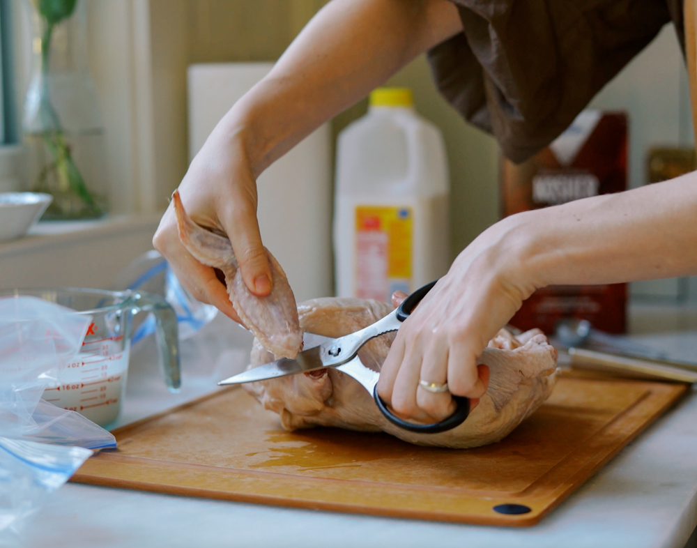 clipping a chicken wing off a whole chicken