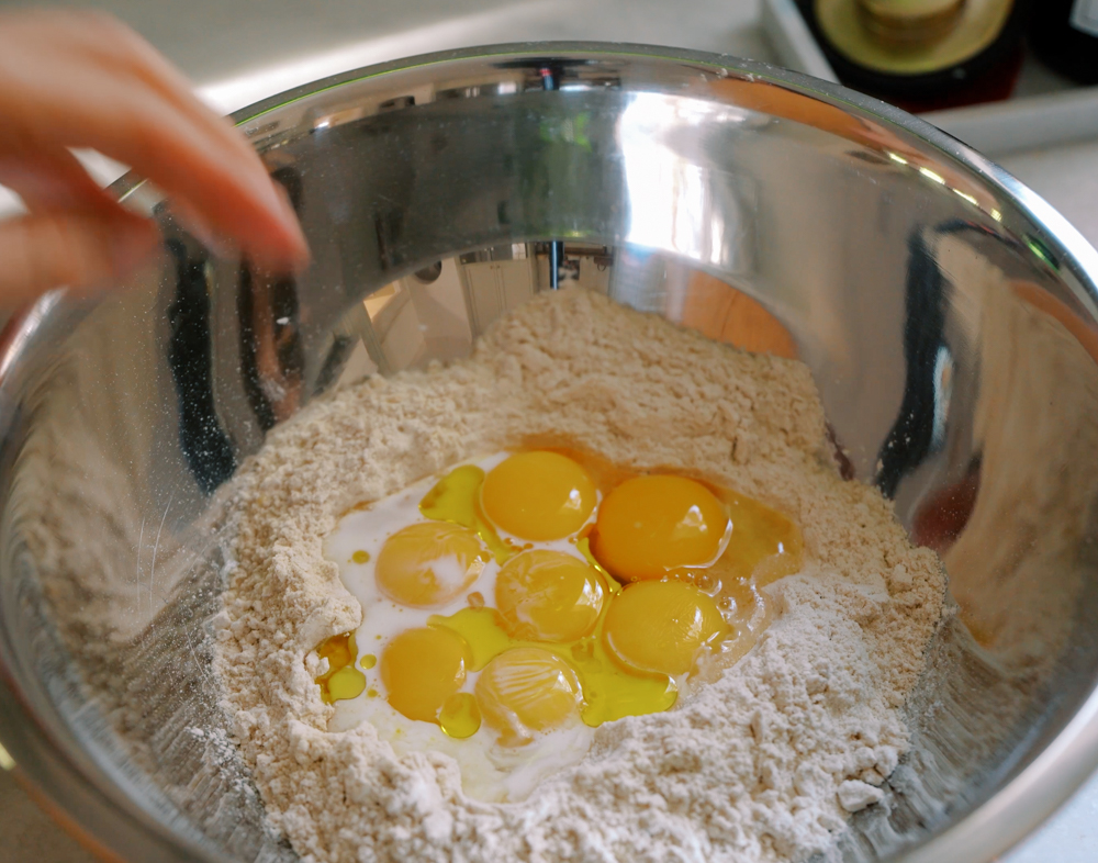 a bowl of flour and eggs