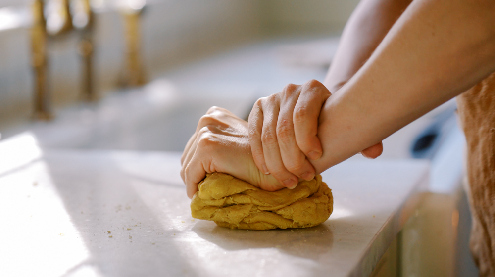 kneading pasta dough by hand