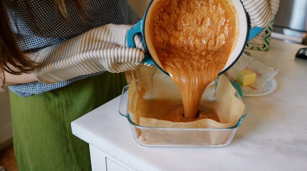 pouring hot caramel into dish