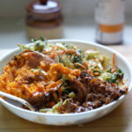 braised beef bowls with sweet potato and cabbage slaw